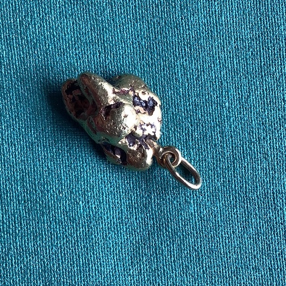 beautiful Goldnugget 14.4 gram smooth with some black inclusions with ring